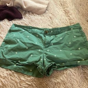 Green old navy shorts w/ daisies on them!!